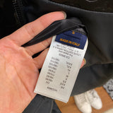 Back view of Louis Vuitton luxury clothing with label-forward styling