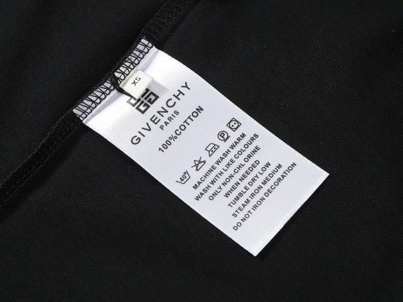 Close-up detail shot of Givenchy luxury clothing with monogram-inspired silhouette