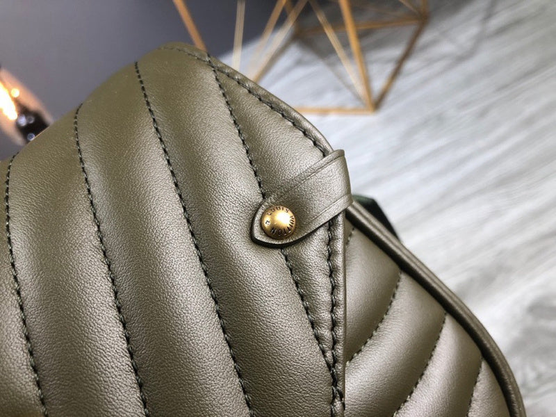 Handle and strap detail of modern chic women's handbag – women's designer-style accessory