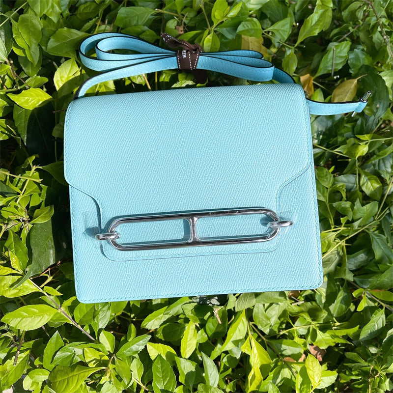 Side view of poised structured handbag