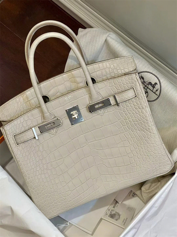 Side view of tailored structured handbag