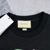 Close-up detail shot of Gucci luxury clothing with signature branding