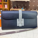 Side view of fluid structured handbag
