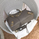 Handle and strap detail of structured statement women's handbag – women's designer-style accessory
