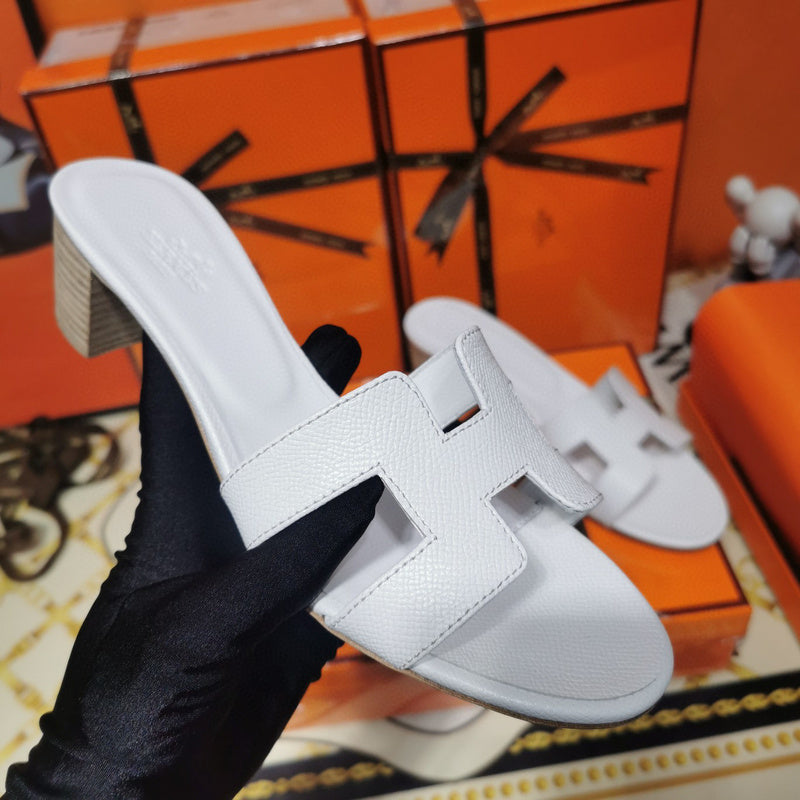Hermes sandals Style 014 - front view, iconic logo design