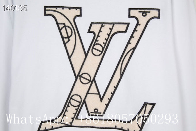 Full styled look of Louis Vuitton luxury clothing with label-forward styling