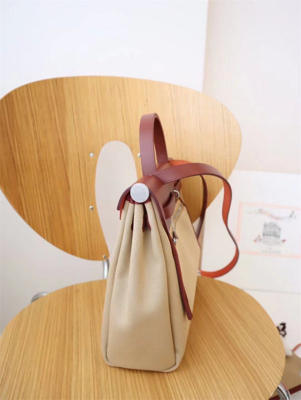 Side view of sculpted structured handbag