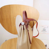 Side view of sculpted structured handbag