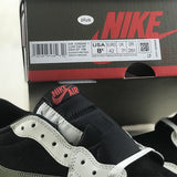 Side profile of Nike muted earth tones sneakers low-top design