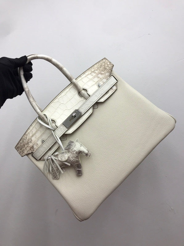 Side view of modern structured handbag