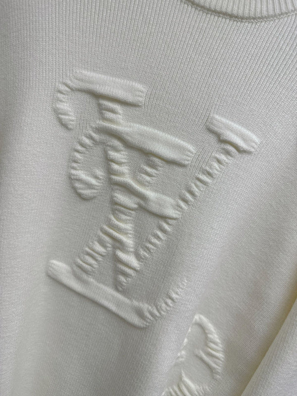 Flat lay presentation of Louis Vuitton luxury clothing with relaxed-fit cut