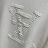Flat lay presentation of Louis Vuitton luxury clothing with relaxed-fit cut