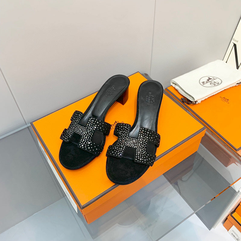 Hermes sandals Style 186 - close-up of iconic logo design