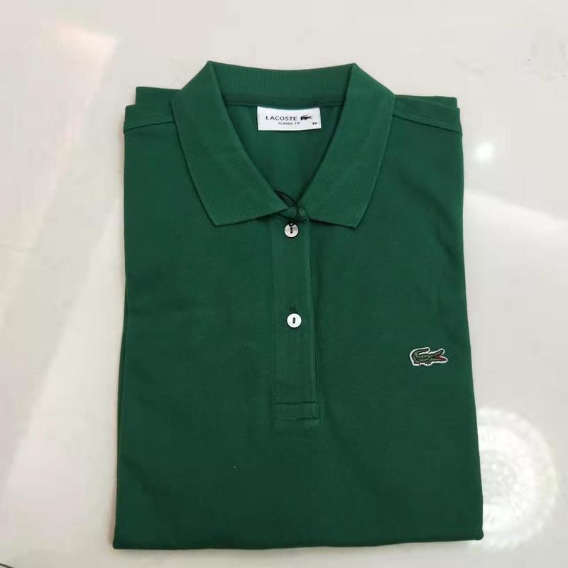 Close-up detail shot of Lacoste luxury clothing with signature branding