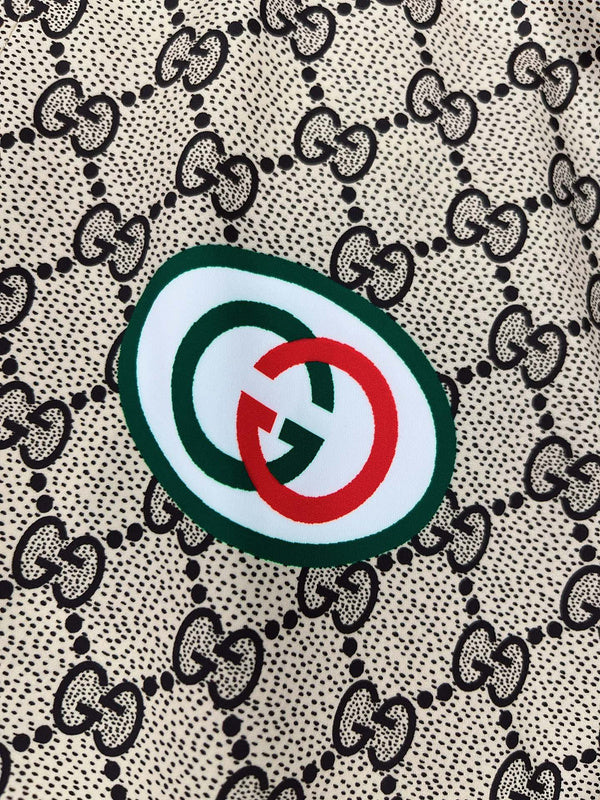 Close-up detail shot of Gucci luxury clothing with logo-detail design