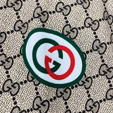 Close-up detail shot of Gucci luxury clothing with logo-detail design