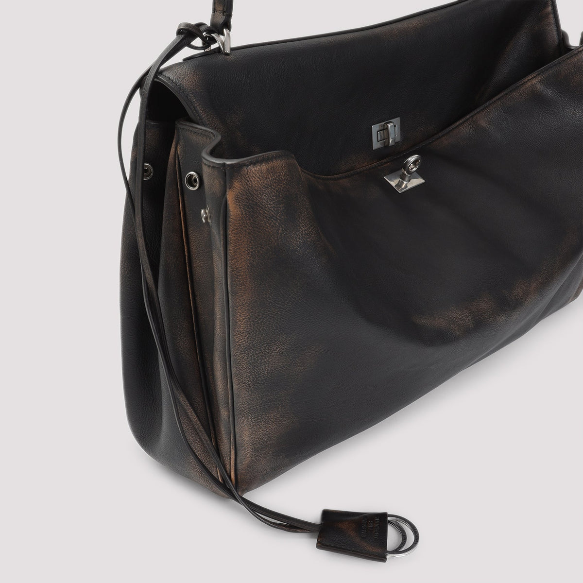 Close-up of Balenciaga handbags hardware and fine stitching