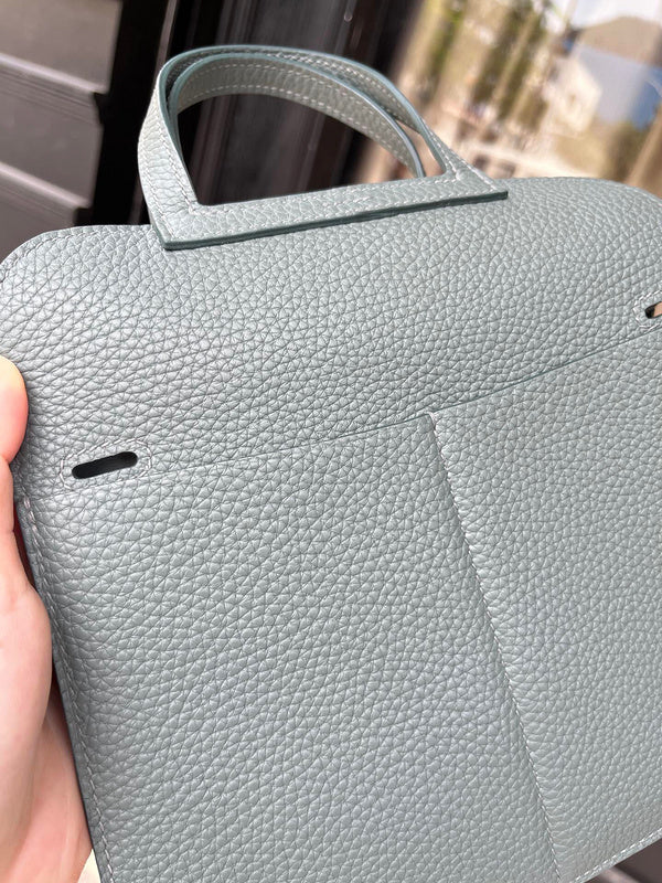 Side view of modernist structured handbag
