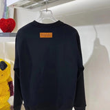 Back view of Louis Vuitton luxury clothing with runway-inspired design