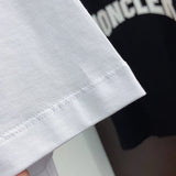 Flat lay presentation of Moncler luxury clothing with contemporary cut