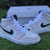 Side profile of Nike neutral cream sneakers sleek tonal finish