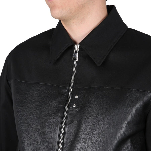 Close-up of Alexander McQueen jackets hardware and fine stitching