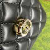 Side profile of signature polished women's handbag – women's luxury accessory