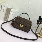 Front view of refined elevated women's handbag – women's luxury handbag