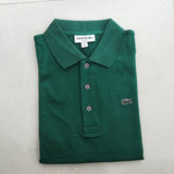 Flat lay presentation of Lacoste luxury clothing with signature branding