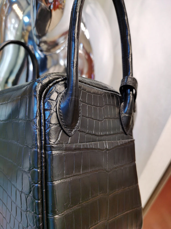 Side view of timeless structured handbag