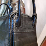 Side view of timeless structured handbag
