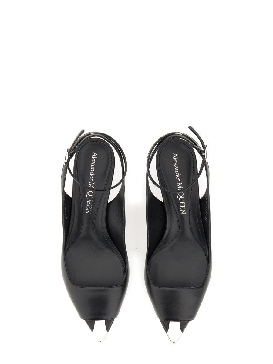 Close-up of Alexander McQueen sandals hardware and fine stitching