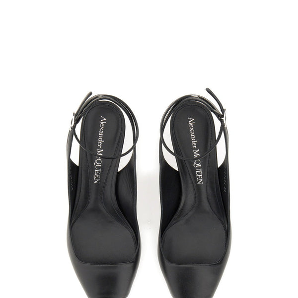Close-up of Alexander McQueen sandals hardware and fine stitching