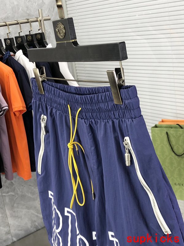 Flat lay presentation of Rhude luxury clothing with logo-detail design