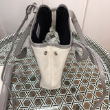Close-up detail of signature polished women's handbag – women's luxury handbag