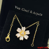 Lifestyle view of Van Cleef & Arpels unisex jewelry piece