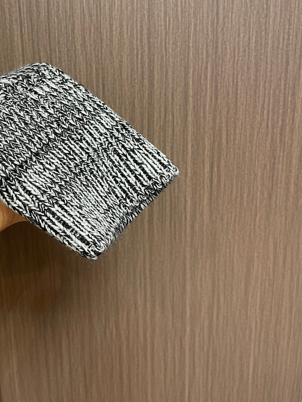 Side profile of Louis Vuitton luxury clothing with logo-detail design