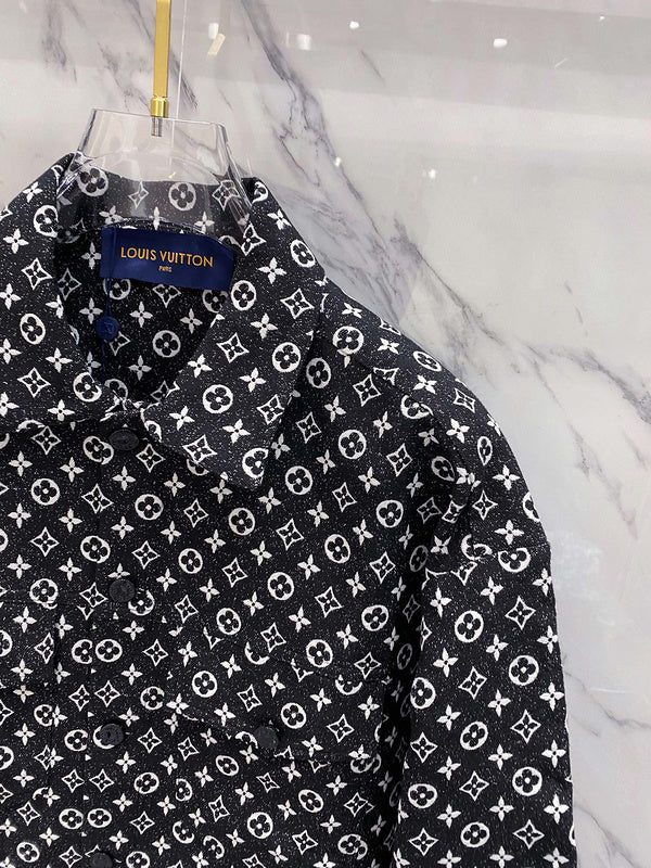 Close-up detail shot of Louis Vuitton luxury clothing with label-forward styling