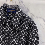 Close-up detail shot of Louis Vuitton luxury clothing with label-forward styling