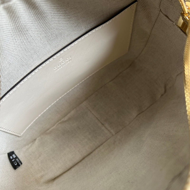 Side profile of statement modern women's handbag – women's luxury accessory