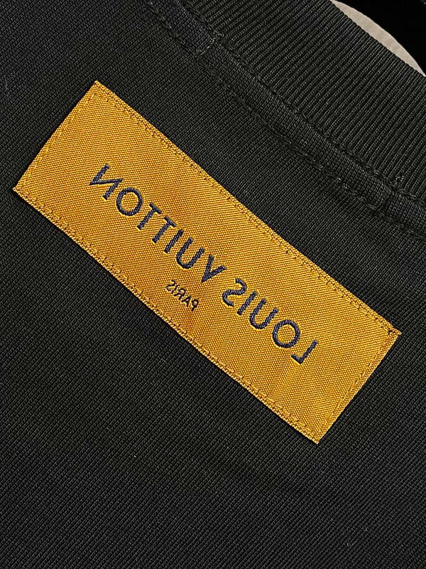 Close-up detail shot of Louis Vuitton cotton t-shirt with logo-detail design