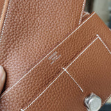  Signature shoulder bag carried on shoulder