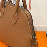 Side view of minimalist structured handbag