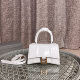 Close-up detail of structured signature women's handbag – women's premium purse