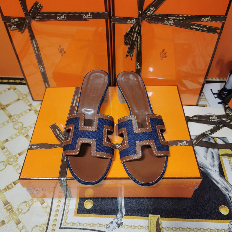 Hermes sandals Style 053 - close-up of iconic logo design