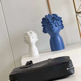 Styled lifestyle shot of modern elevated women's handbag – women's luxury handbag
