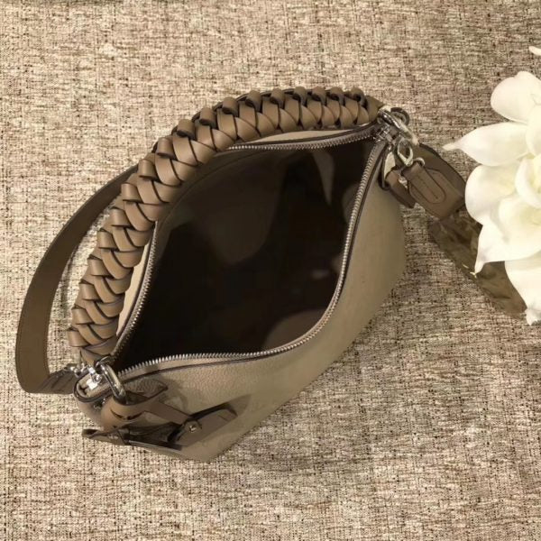 Handle and strap detail of statement premium women's handbag – women's luxury accessory