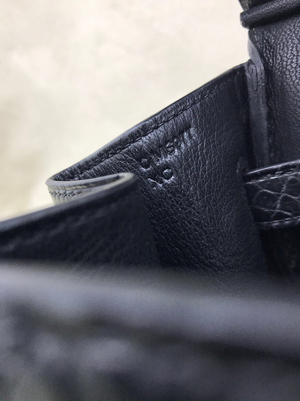 Side view of poised structured handbag