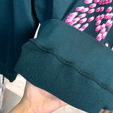Close-up detail shot of Louis Vuitton luxury clothing with everyday silhouette