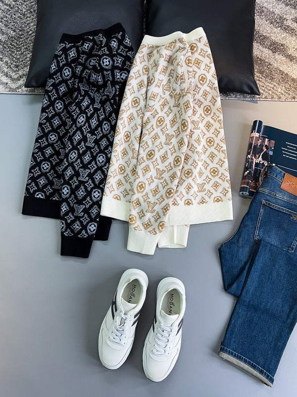 Flat lay presentation of Louis Vuitton luxury clothing with monogram-inspired silhouette